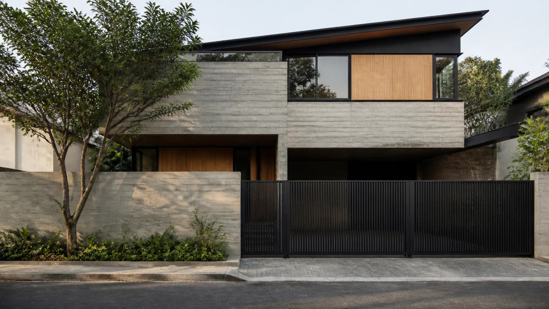Contemporary concrete and timber residence with tropical planting
